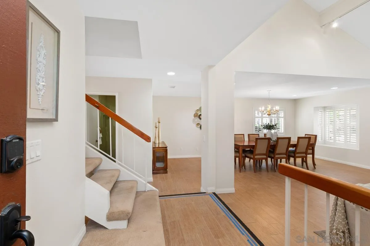 4219 Rueda Drive San Diego, CA 92124 - Photo 6 of 36 a view of a dining room with furniture window and wooden floor