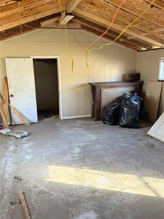a view of a garage with wooden floor