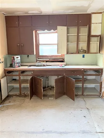 a kitchen with a sink and a stove