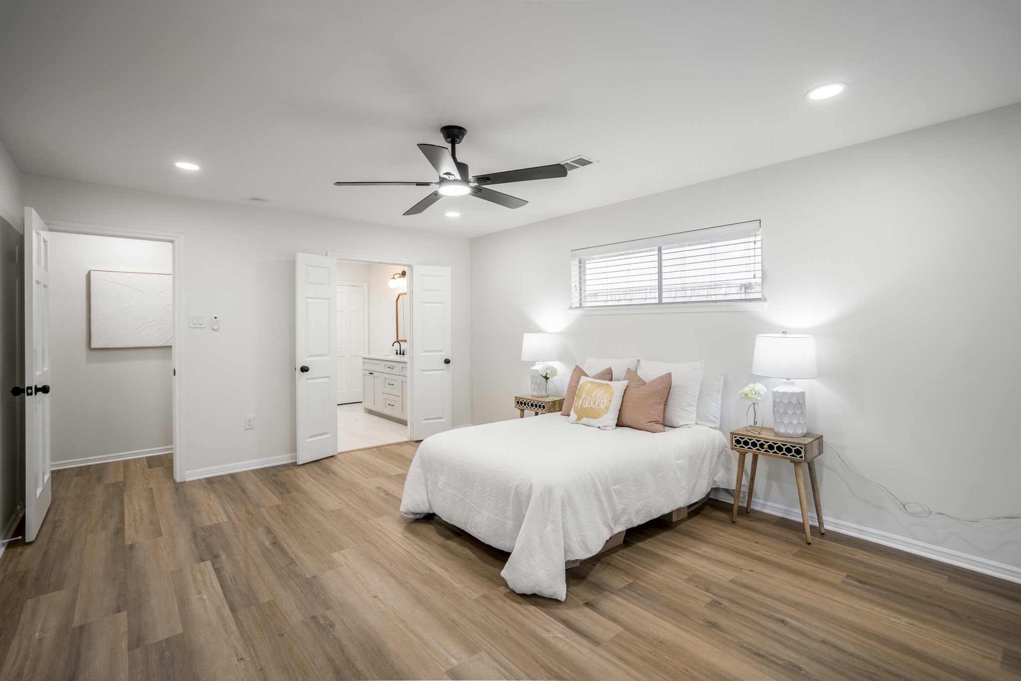 8006 Vickridge Lane Spring, TX 77379 - Photo 21 of 50 a bedroom with a bed and a chandelier