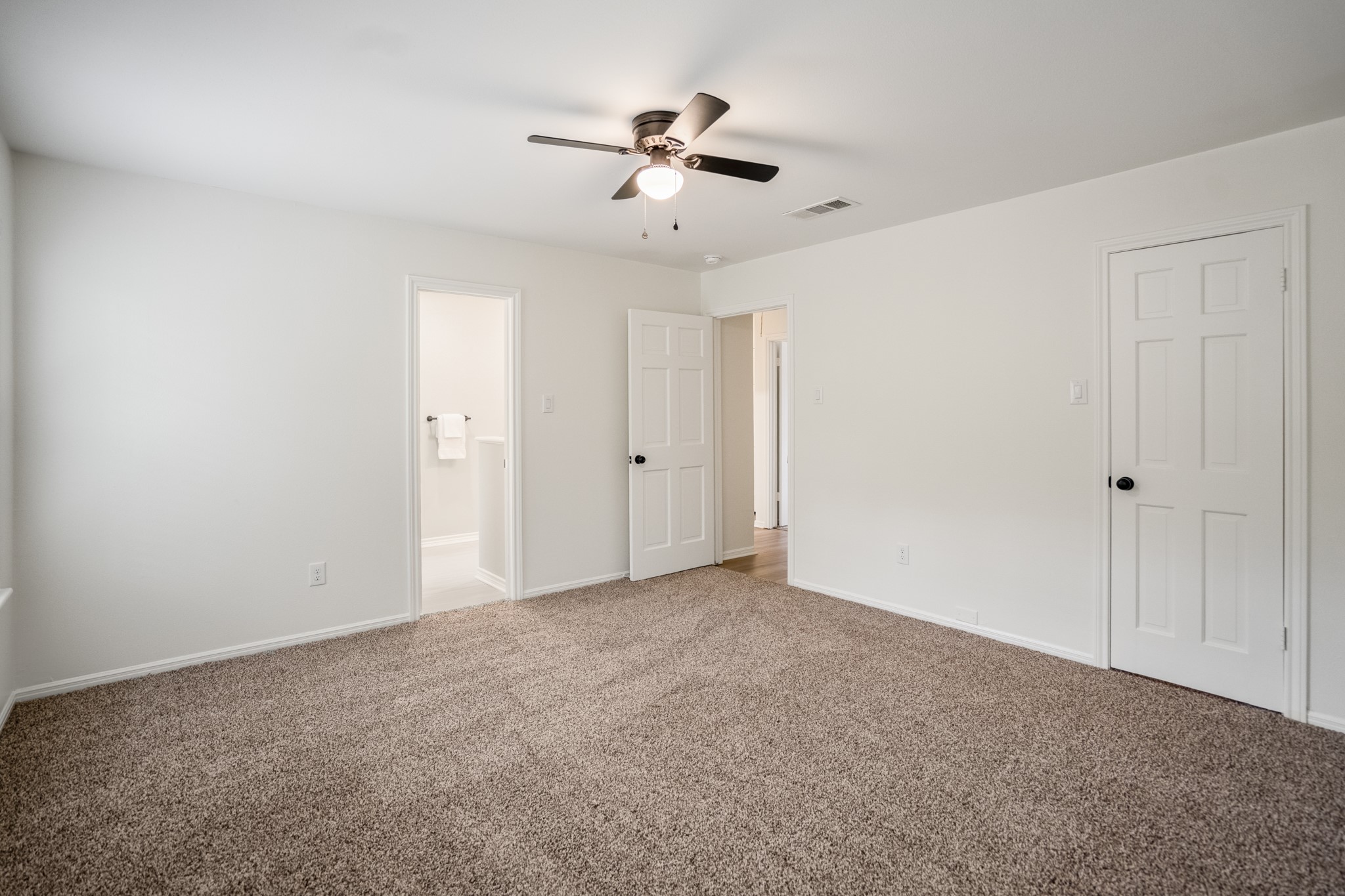 8006 Vickridge Lane Spring, TX 77379 - Photo 30 of 50 This upstairs bedroom offers fresh carpet, updated lighting, and easy access to the nearby bathrooms—providing a comfortable, well-sized space with simple finishes ready to make your own.