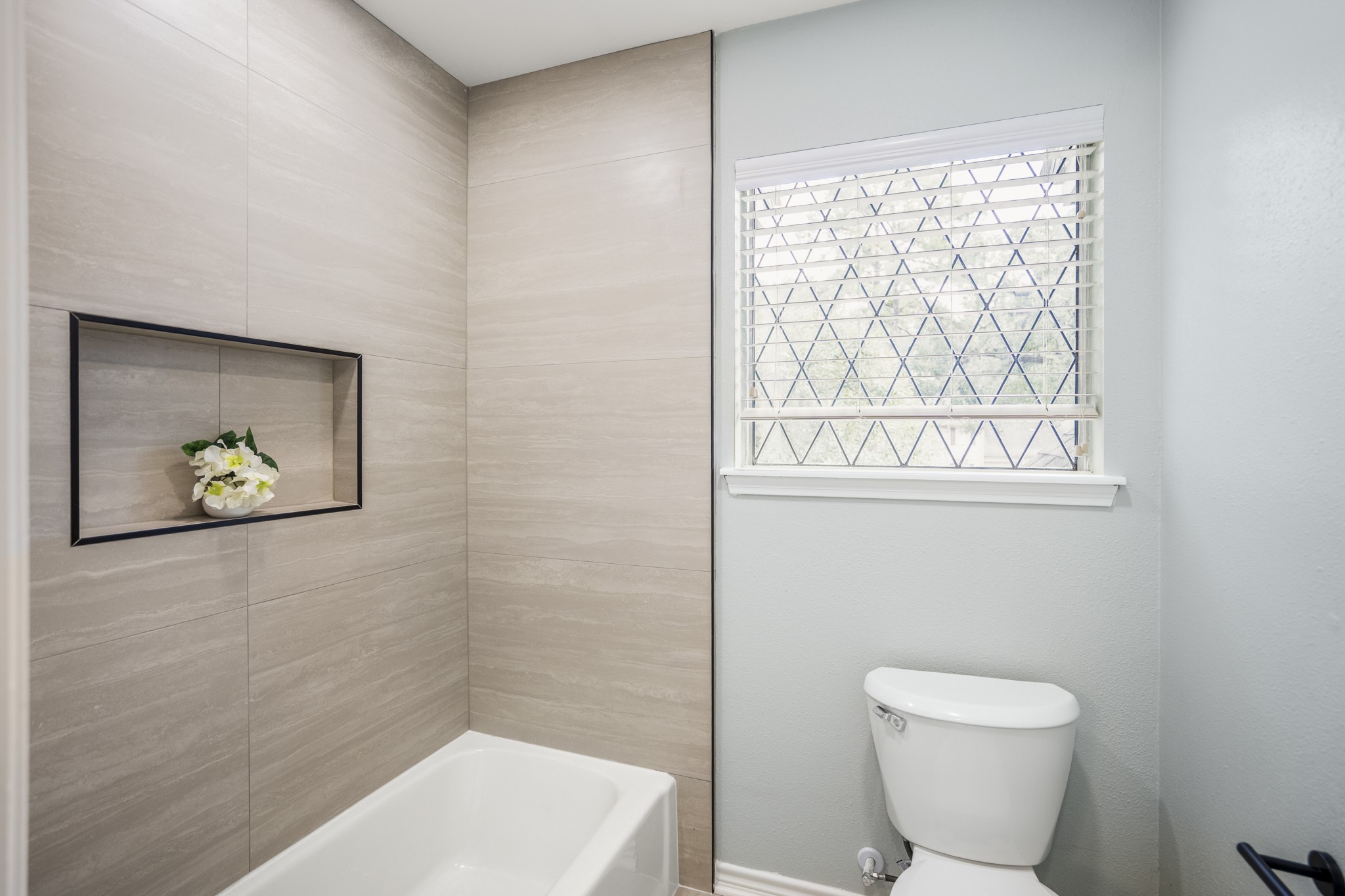 8006 Vickridge Lane Spring, TX 77379 - Photo 33 of 50 a bathroom with a toilet and a picture on the wall