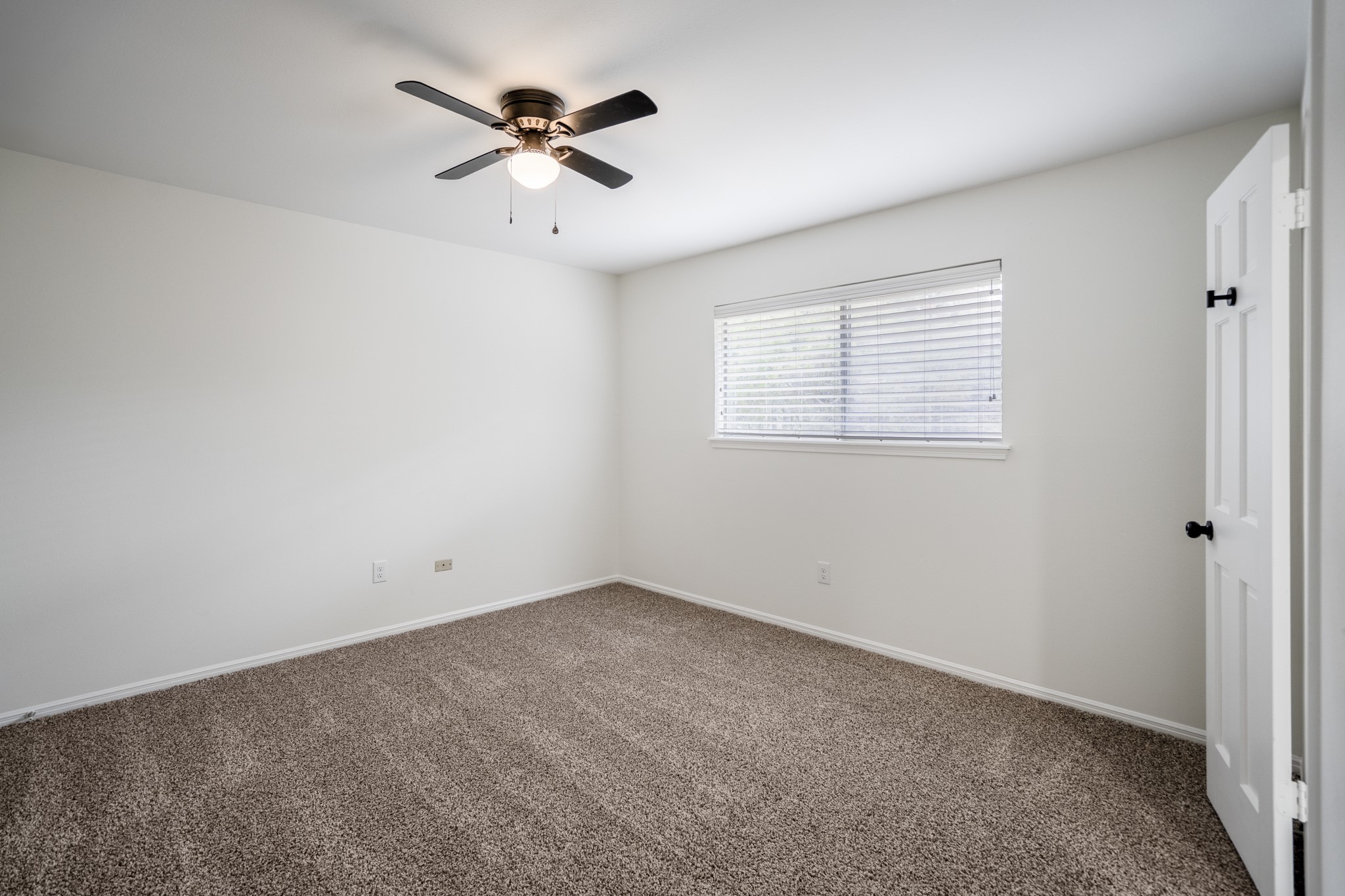 8006 Vickridge Lane Spring, TX 77379 - Photo 38 of 50 an empty room with a window and a fan