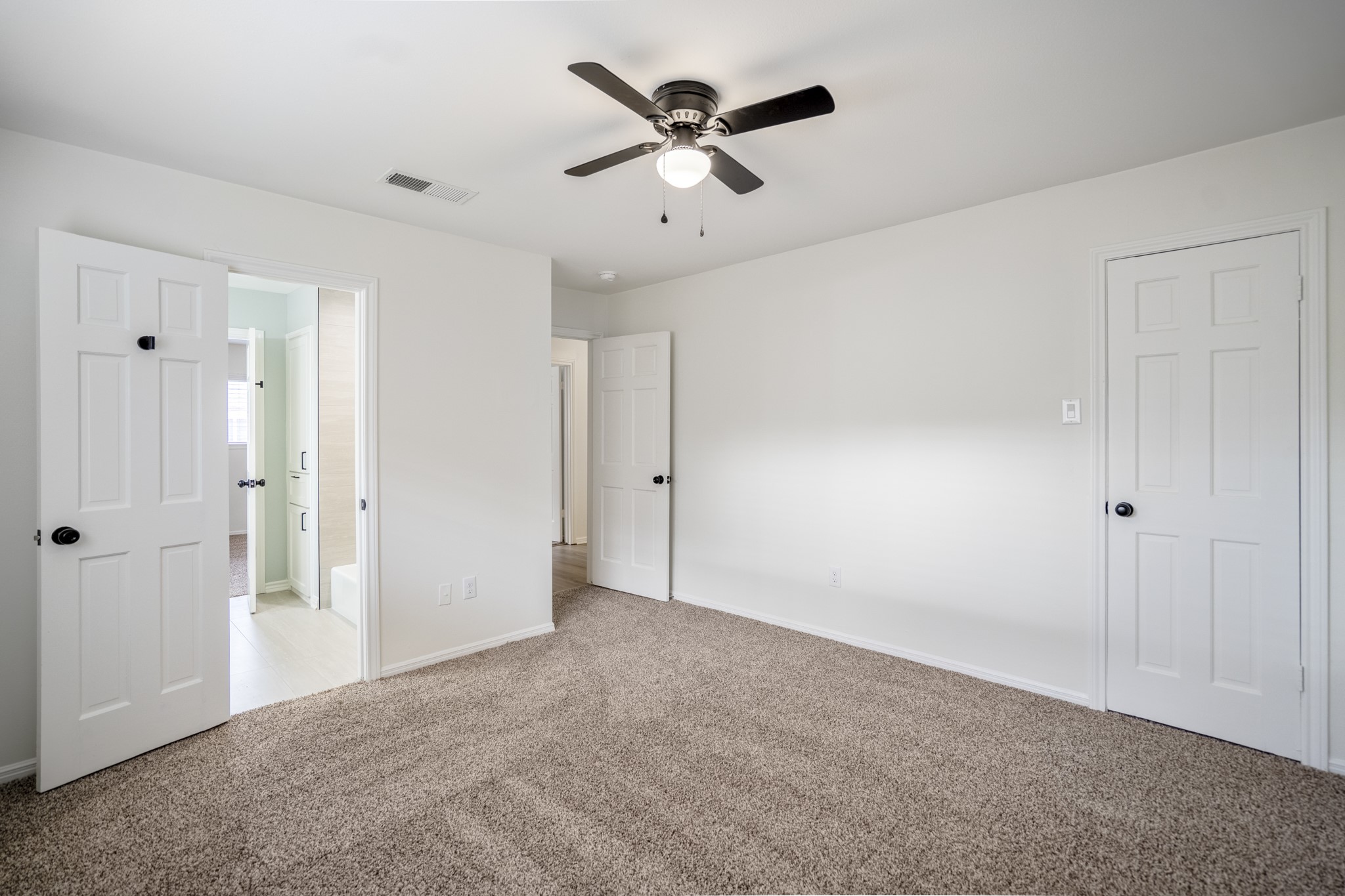8006 Vickridge Lane Spring, TX 77379 - Photo 39 of 50 Another look at the fourth upstairs bedroom shows its refreshed carpet, updated ceiling fan, and convenient access to the "jack-and-jill" bathroom.