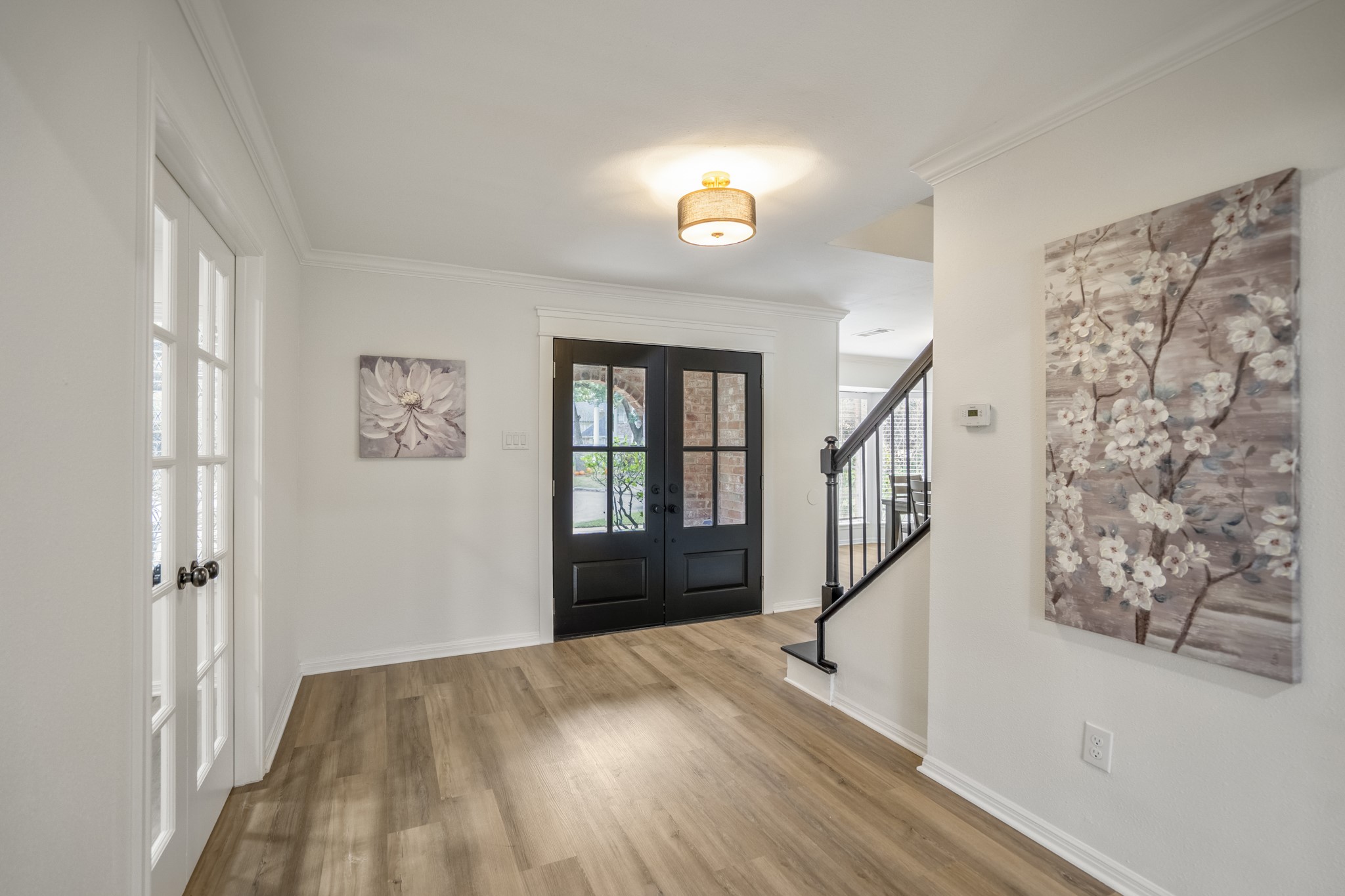 8006 Vickridge Lane Spring, TX 77379 - Photo 5 of 50 a view of entryway with wooden floor