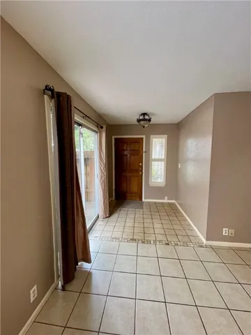 a view of an empty room and window