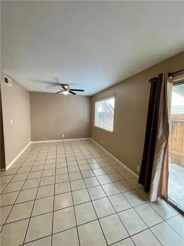 a view of an empty room and window