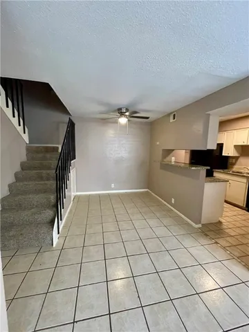 a view of a kitchen with microwave and cabinets