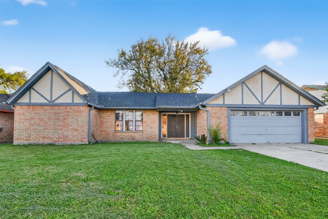 10706 Sagebluff Drive Houston, TX 77089 - Photo 1 of 19 a view of a house with a yard and pathway