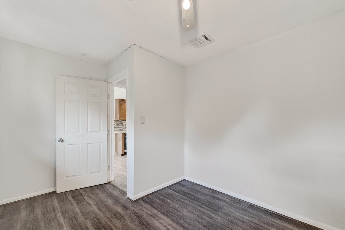 10706 Sagebluff Drive Houston, TX 77089 - Photo 15 of 19 a view of an empty room with wooden floor