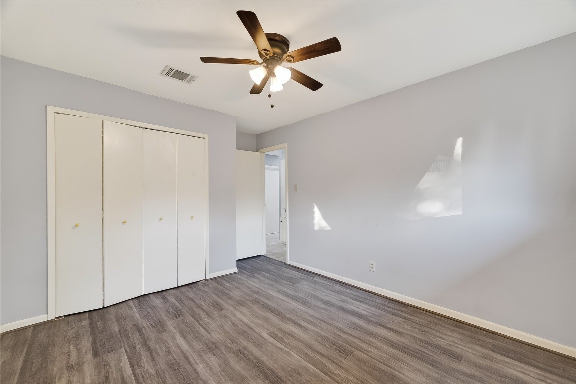 10706 Sagebluff Drive Houston, TX 77089 - Photo 16 of 19 a view of an empty room with wooden floor