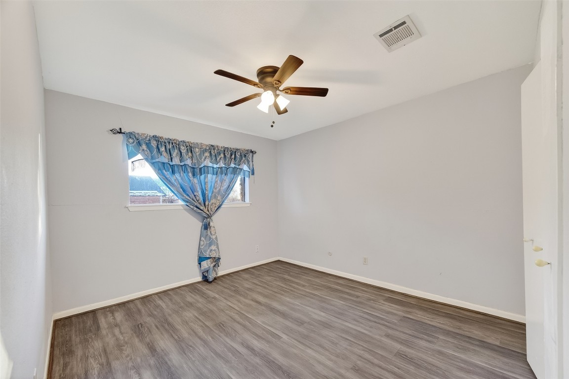 10706 Sagebluff Drive Houston, TX 77089 - Photo 17 of 19 a view of empty room with wooden floor