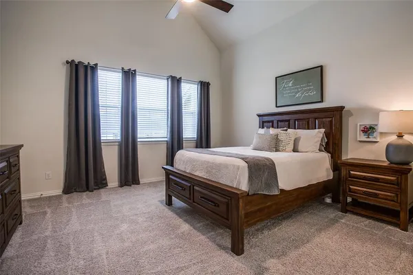 a bed room with a bed and a television
