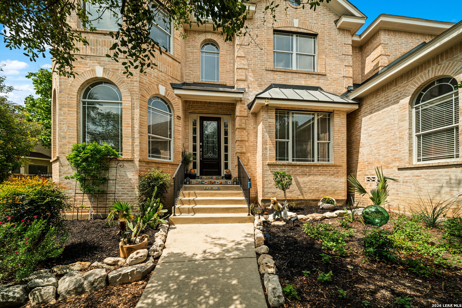24815 Birdie Ridge San Antonio, TX 78260 - Photo 3 of 67 a view of a house with more windows and flower plants