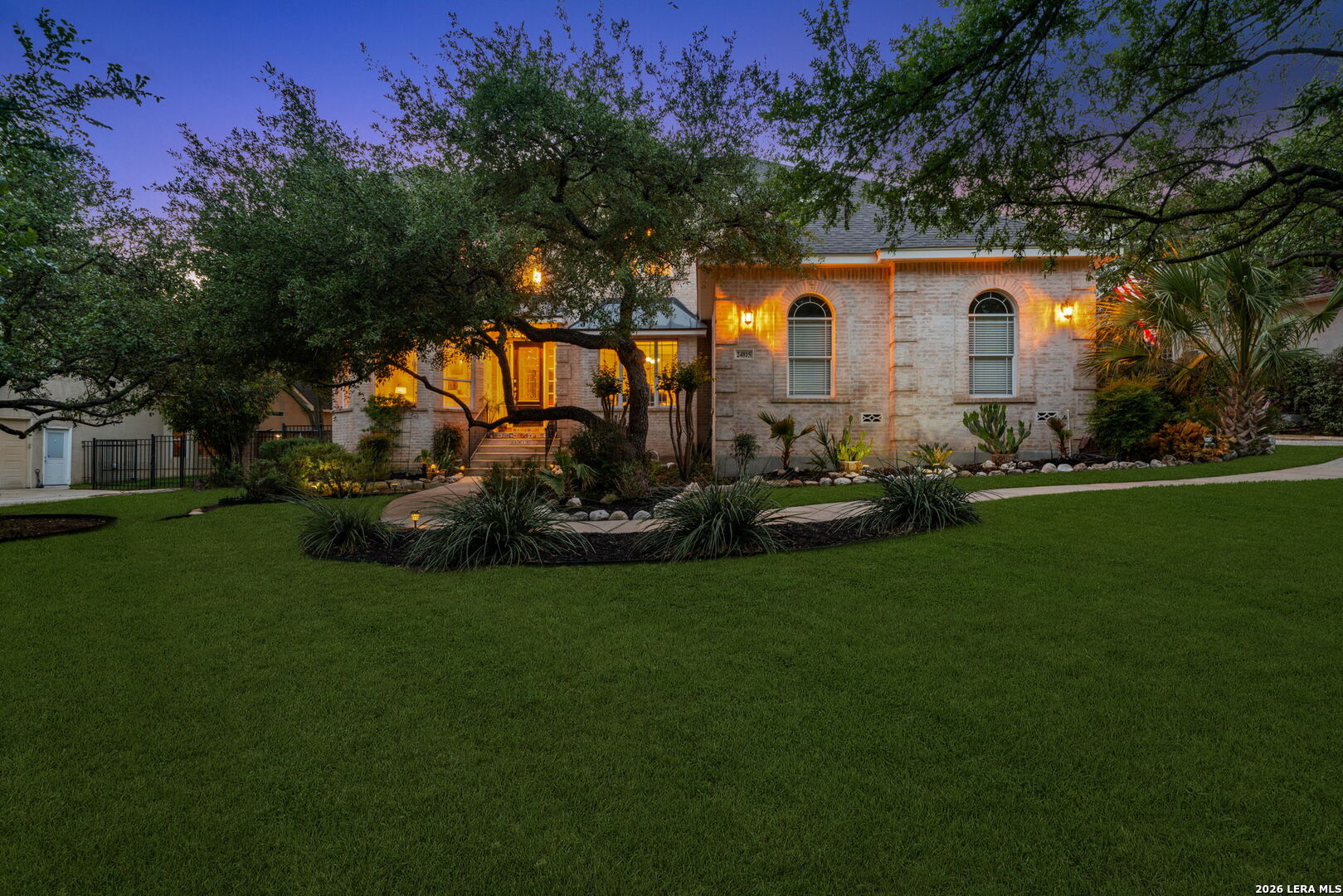 24815 Birdie Ridge San Antonio, TX 78260 - Photo 54 of 67 a front view of a house with a garden