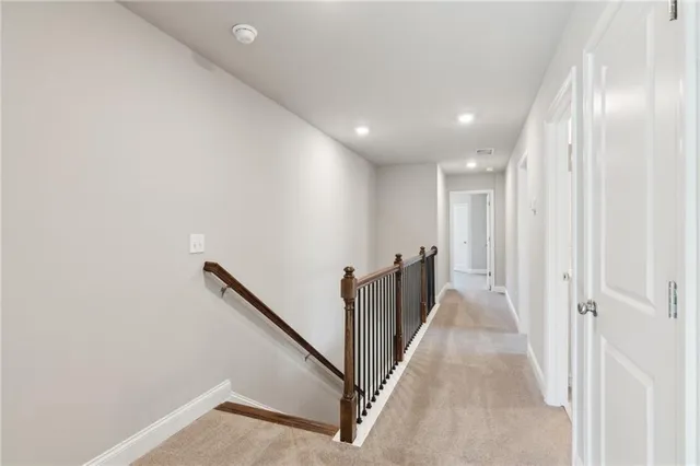 a view of a hallway with stairs