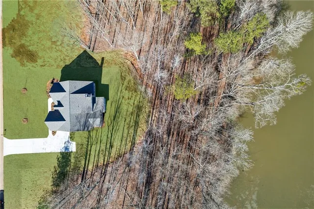 a view of a house with a tree in the background
