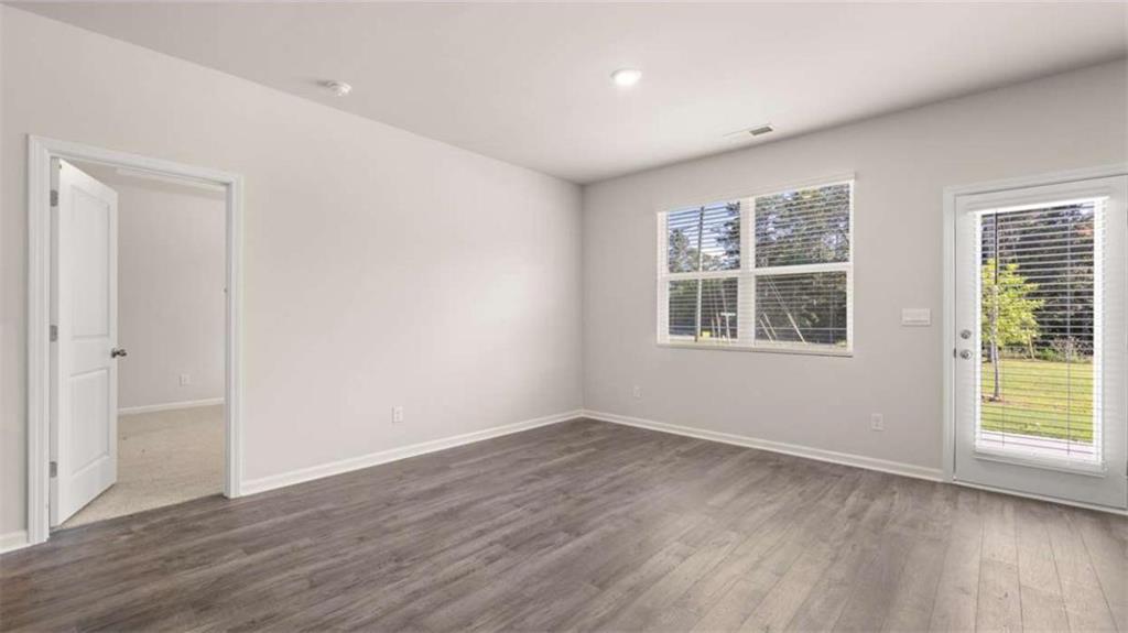88 White Spruce Way Newnan, GA 30265 - Photo 20 of 20 a view of empty room with wooden floor and fan