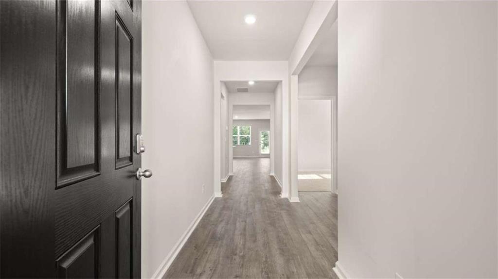 88 White Spruce Way Newnan, GA 30265 - Photo 3 of 20 a view of hallway with stairs