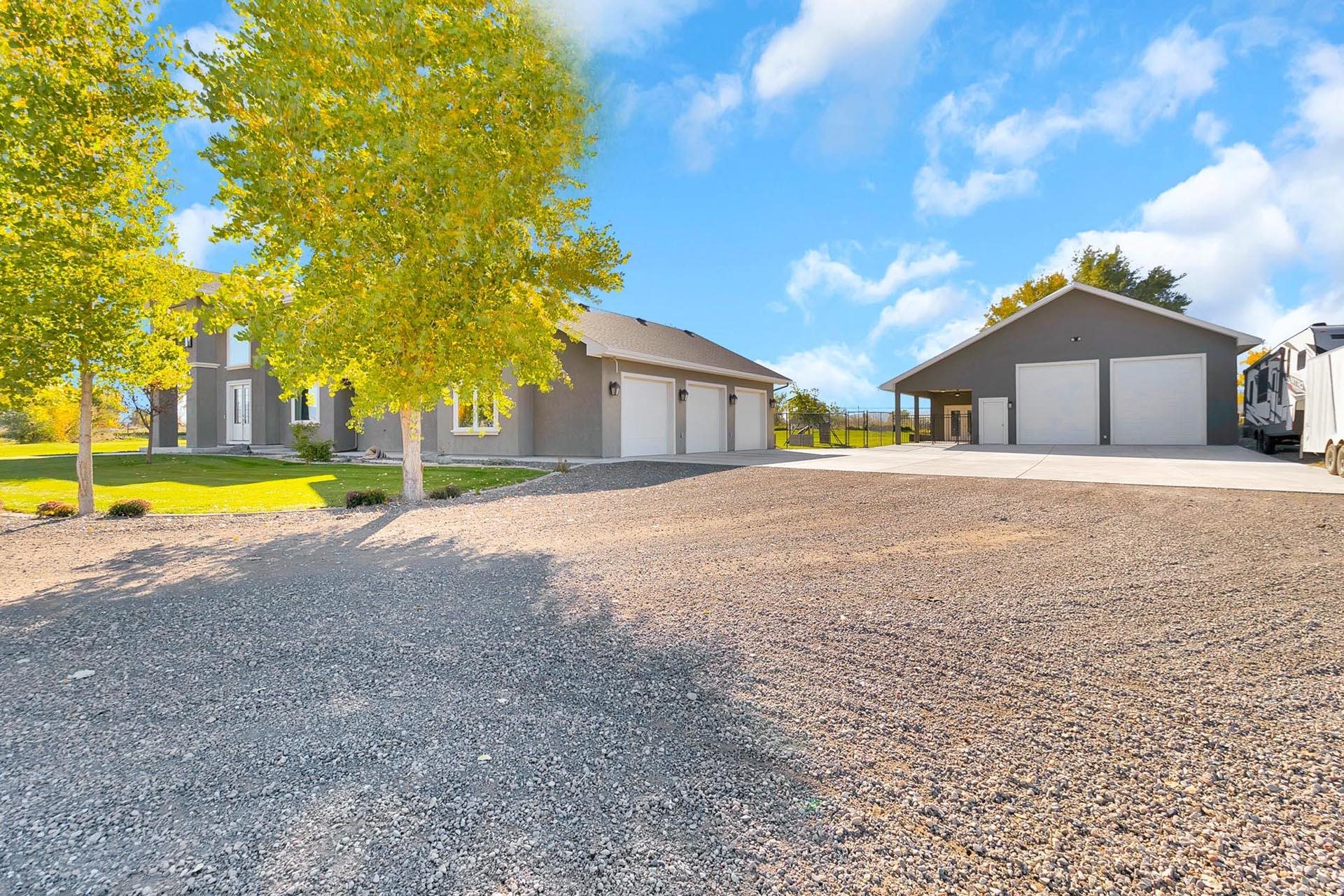 2041 J J 1/2 Road Fruita, CO 81521 - Photo 39 of 42 a view of a house with a yard and large trees