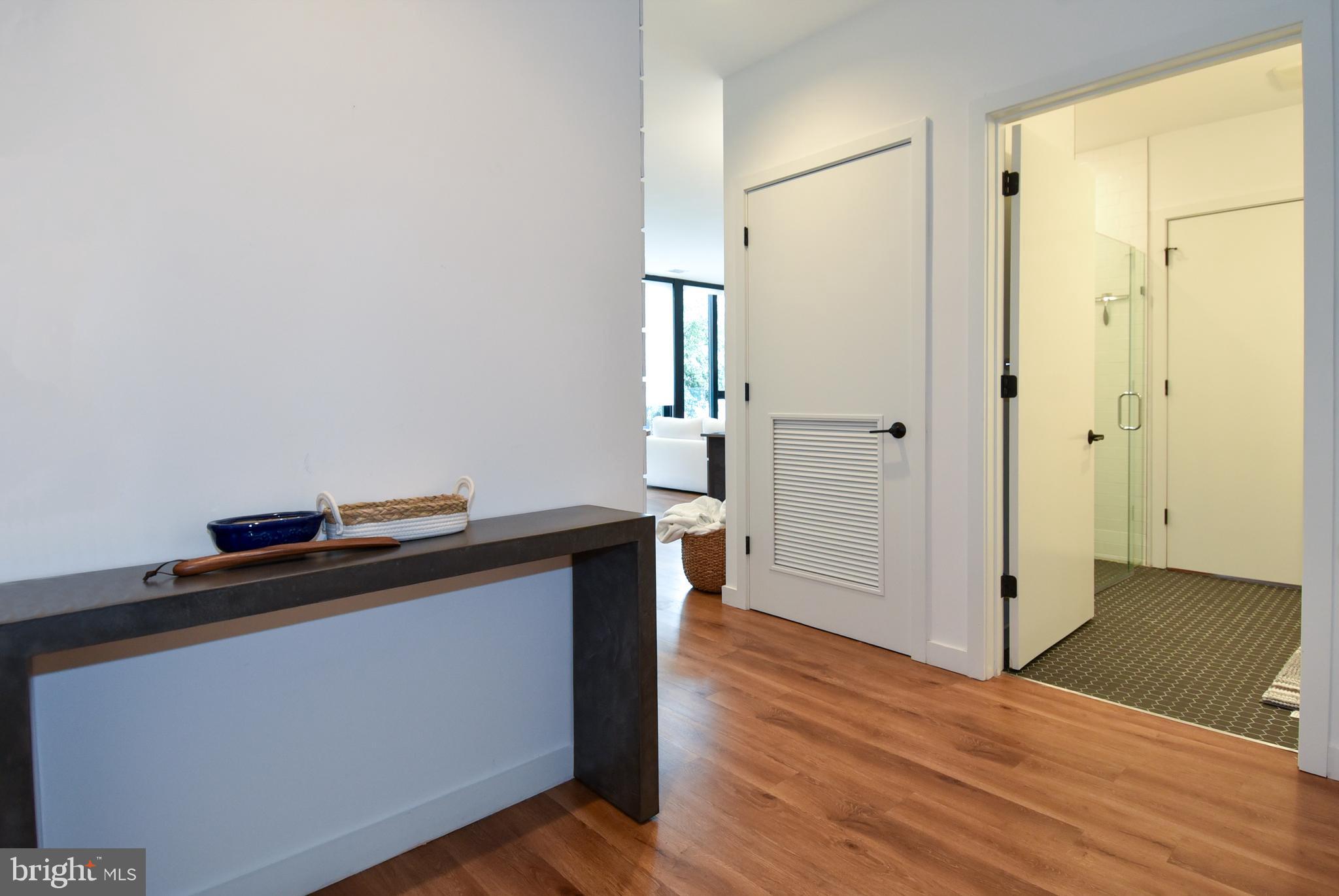 57 N Street Northwest, Unit 225 Washington, DC 20001 - Photo 12 of 38 a view of a hallway with wooden floor