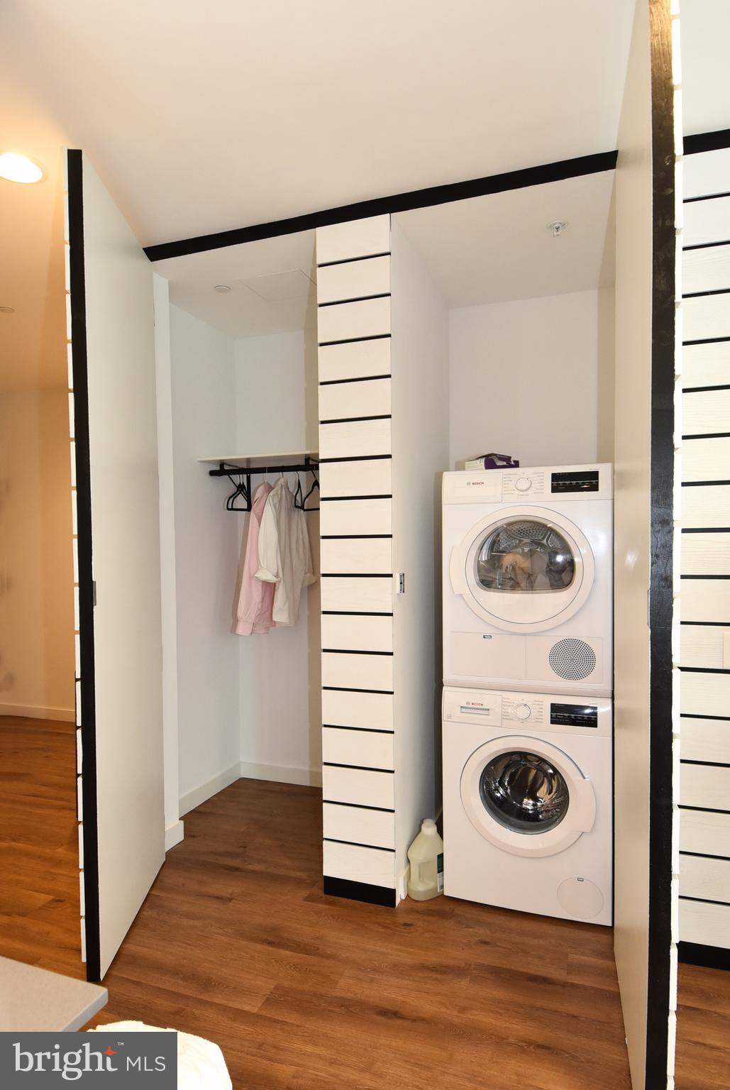 57 N Street Northwest, Unit 225 Washington, DC 20001 - Photo 22 of 38 a view of a storage and utility room with washer and dryer