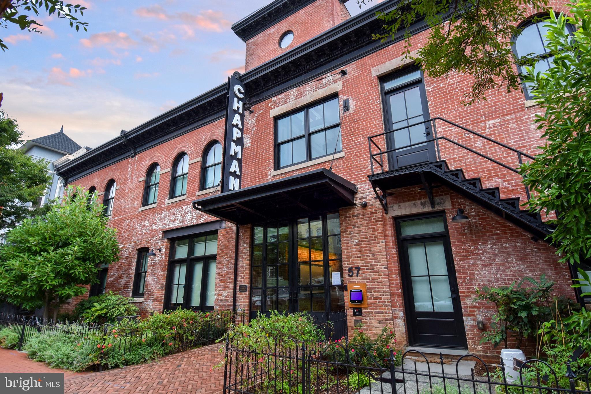 57 N Street Northwest, Unit 225 Washington, DC 20001 - Photo 38 of 38 front view of brick house with a small yard