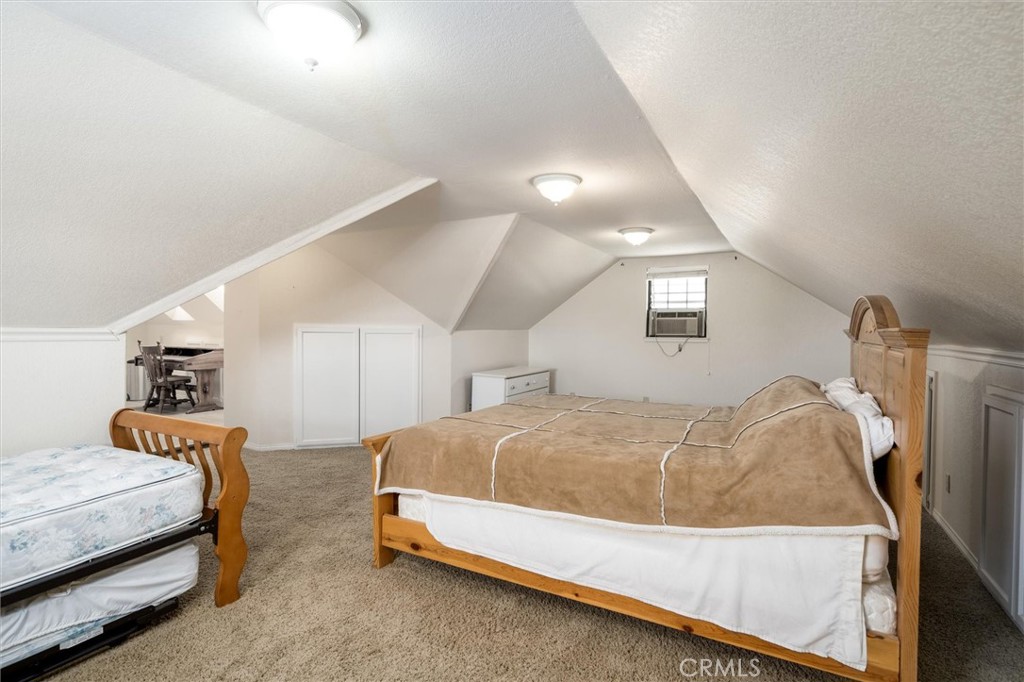 34150 Stowe Road Winchester, CA 92545 - Photo 40 of 80 a bedroom with a bed and a mirror