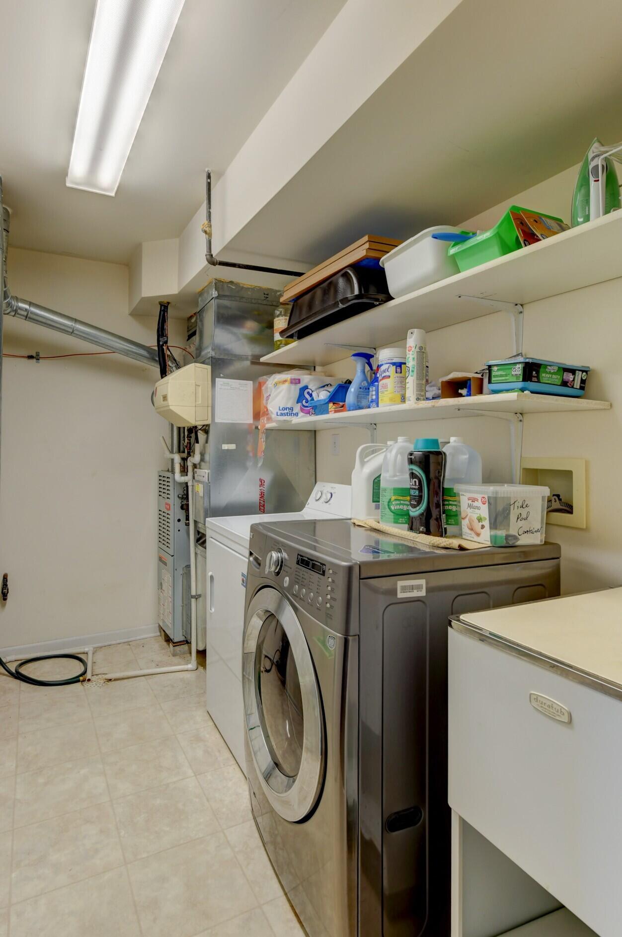 2740 Georgetowne Drive, Unit B1 Highland, IN 46322 - Photo 12 of 22 a utility room with dryer and washer