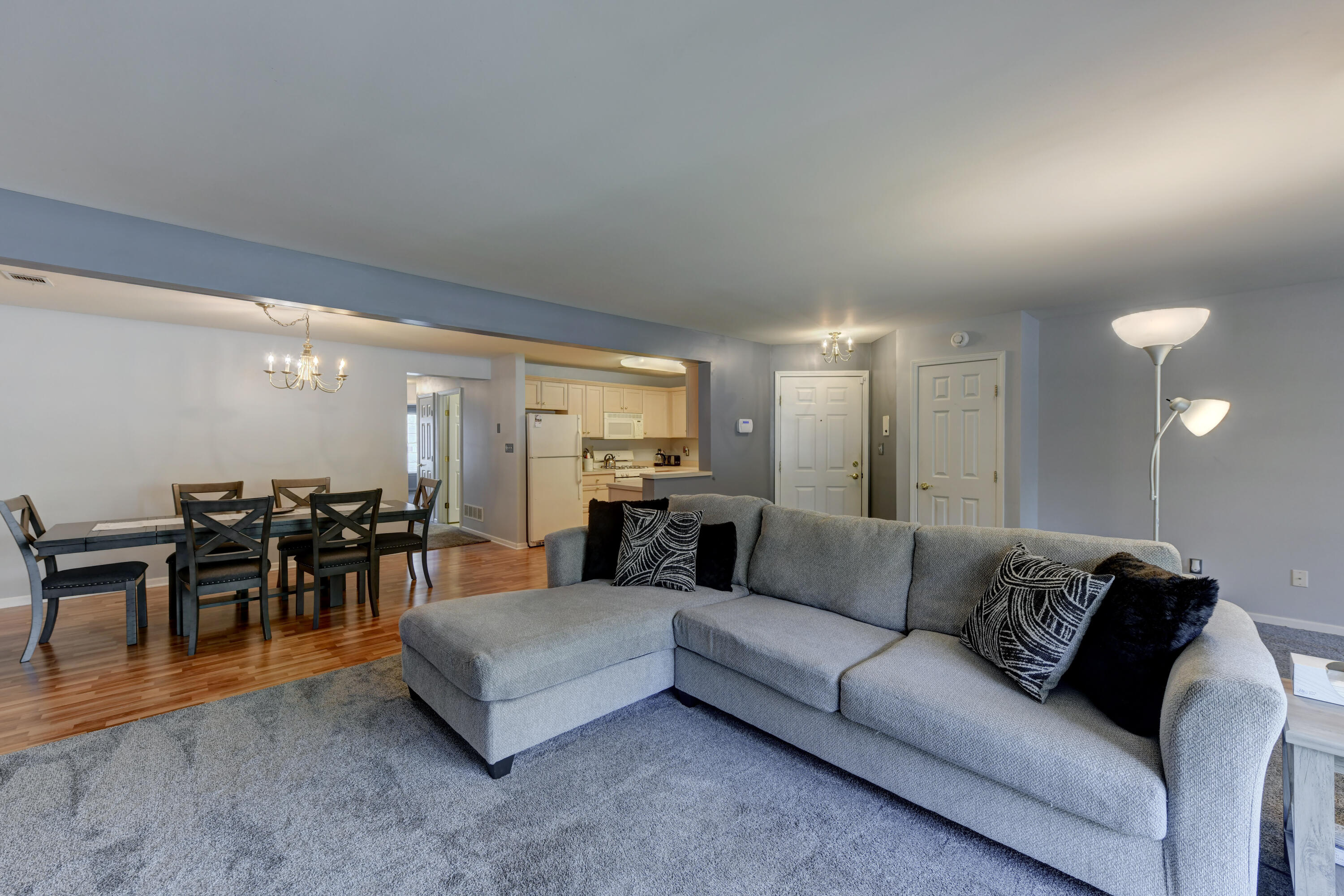 2740 Georgetowne Drive, Unit B1 Highland, IN 46322 - Photo 3 of 22 a living room with furniture and a dining table with kitchen view