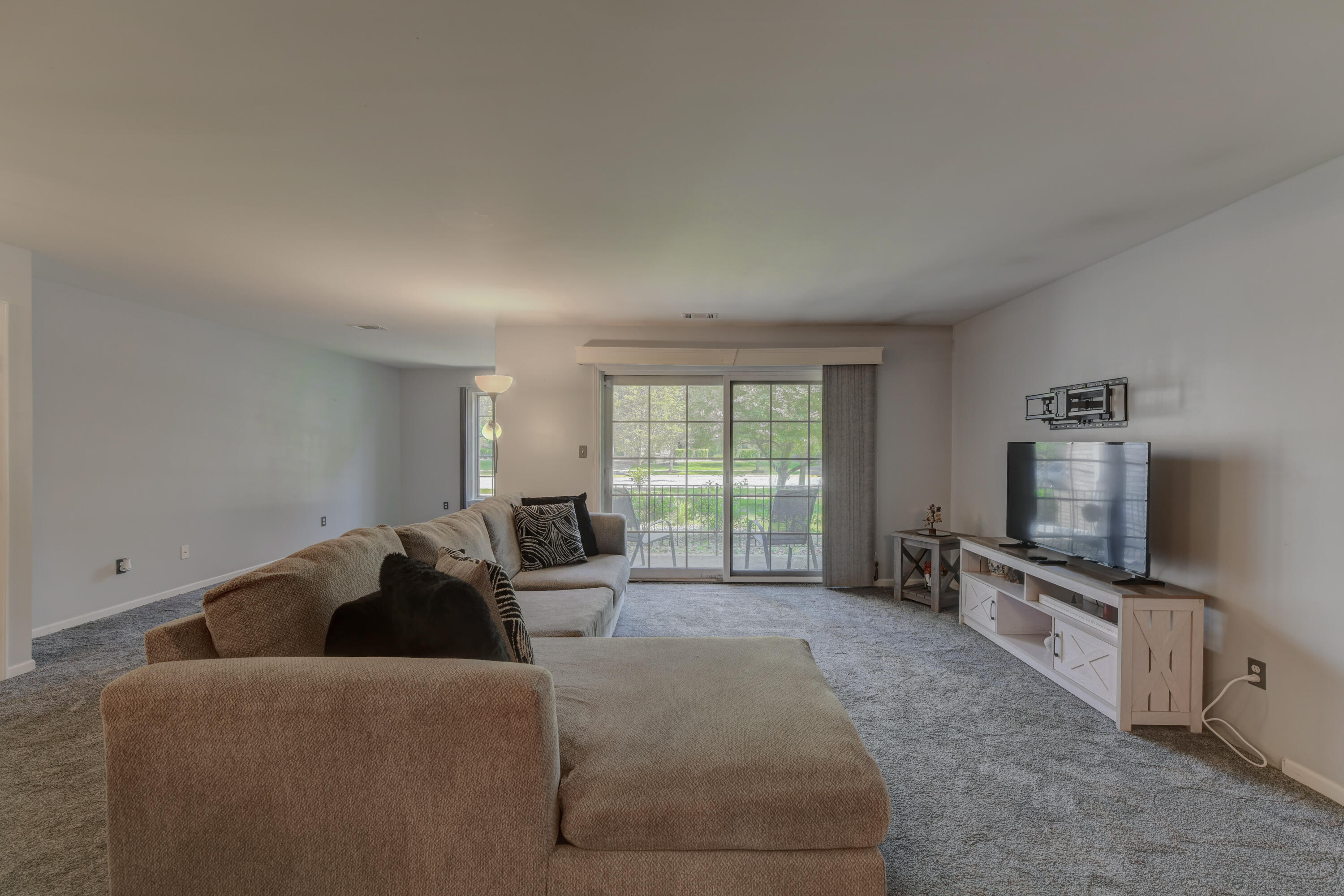 2740 Georgetowne Drive, Unit B1 Highland, IN 46322 - Photo 5 of 22 a living room with furniture and a flat screen tv