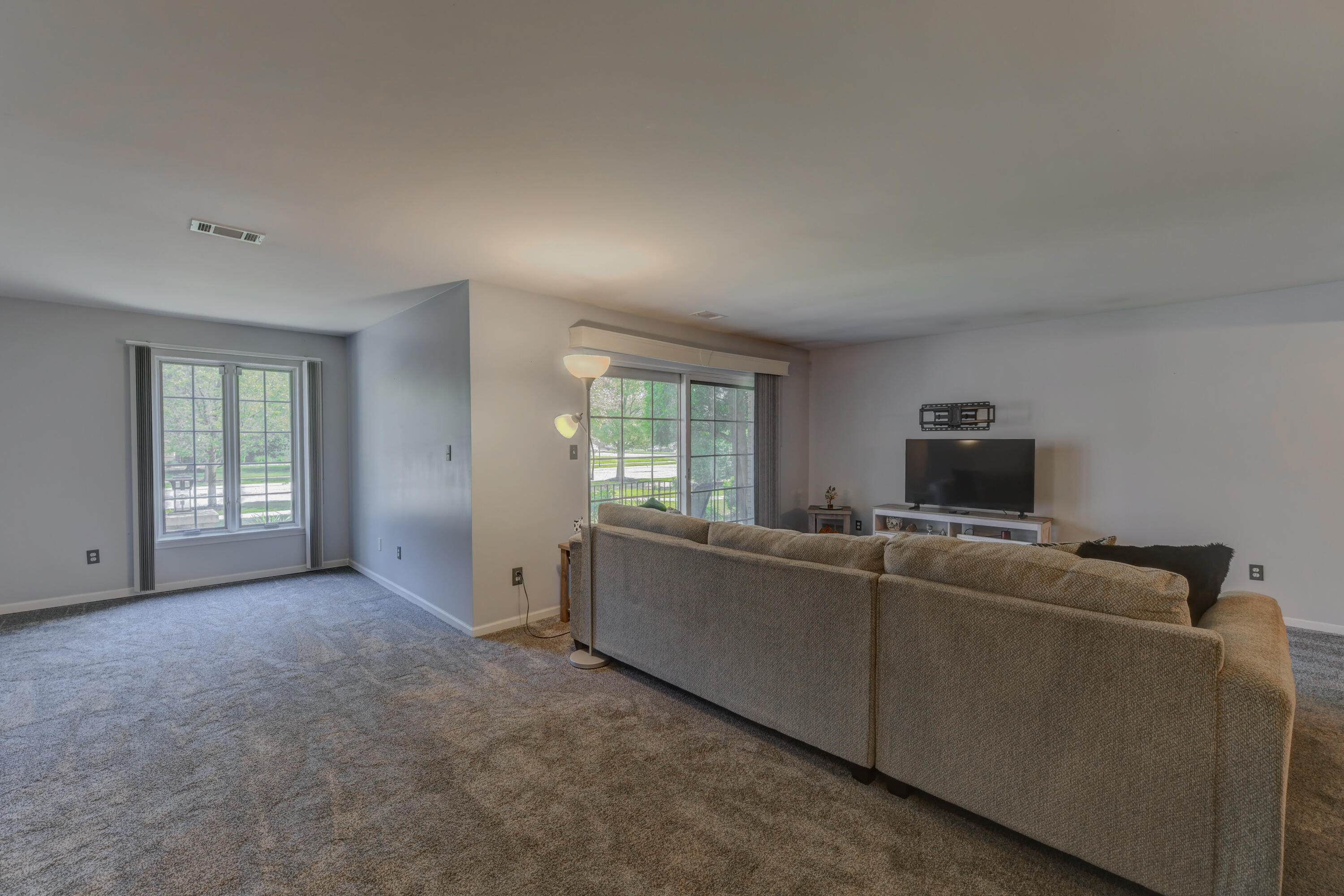 2740 Georgetowne Drive, Unit B1 Highland, IN 46322 - Photo 8 of 22 a living room with furniture and a flat screen tv
