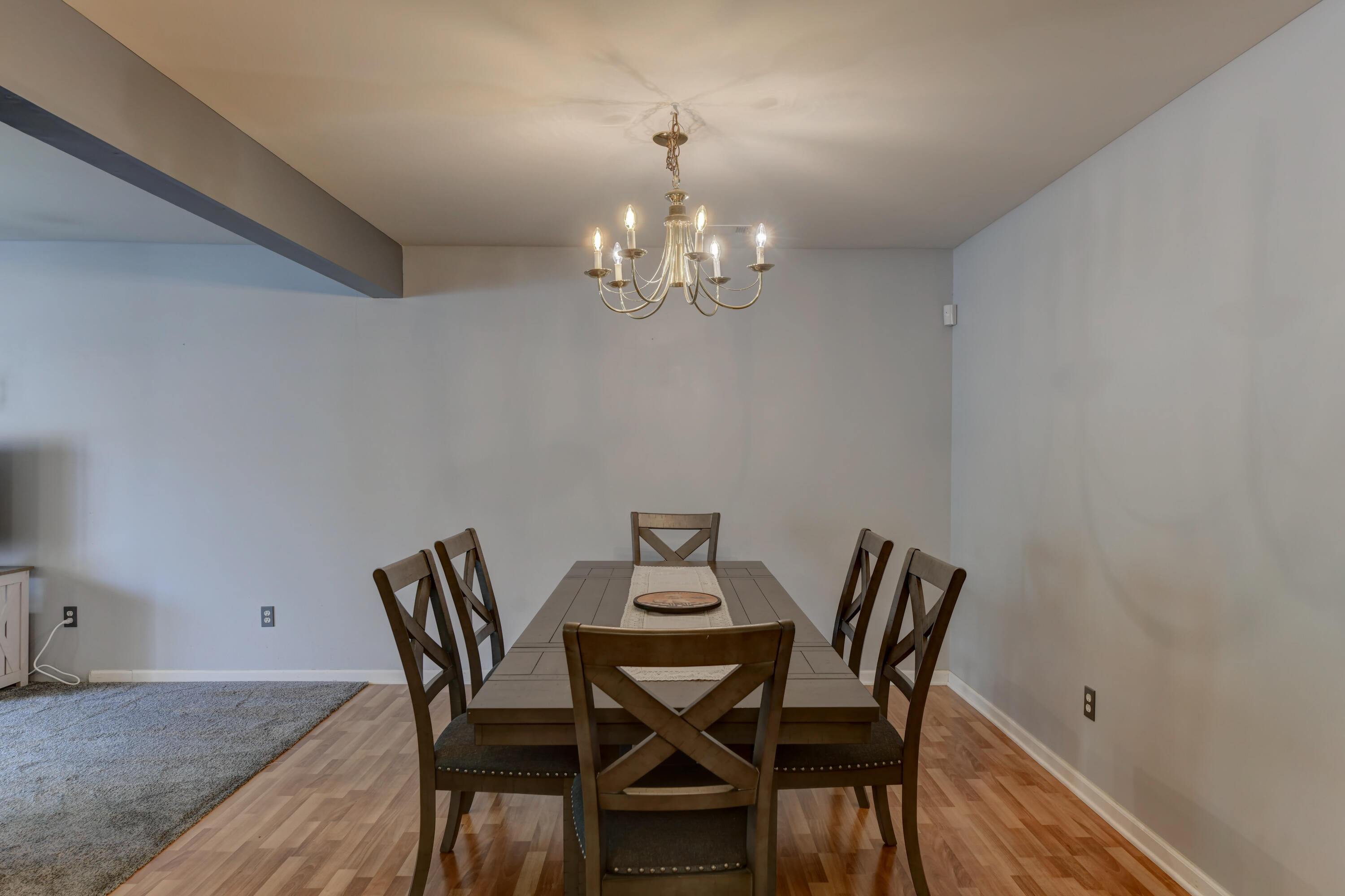 2740 Georgetowne Drive, Unit B1 Highland, IN 46322 - Photo 10 of 22 a view of a dining room with furniture and chandelier