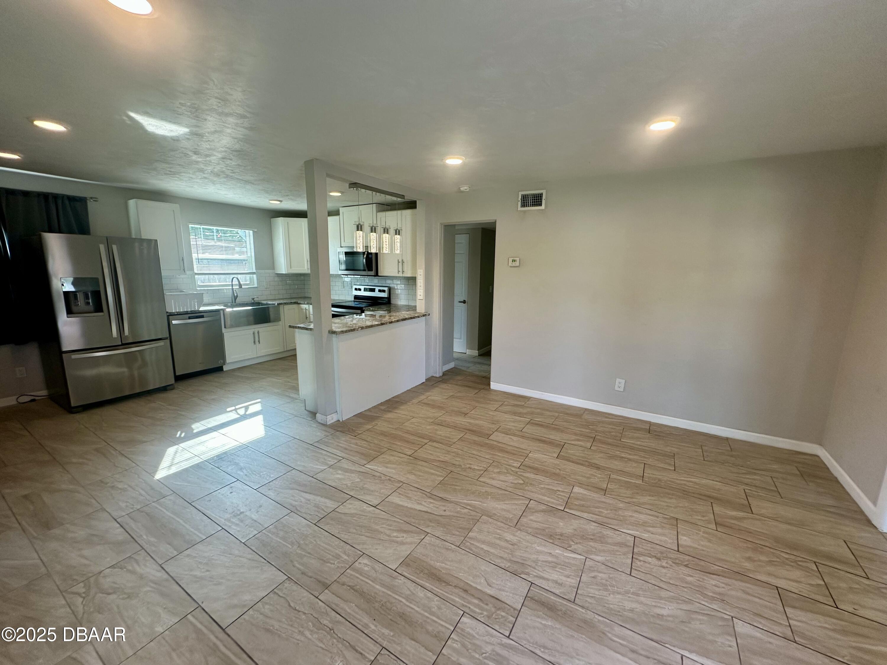 705 Largo Way South Daytona, FL 32119 - Photo 2 of 11 a view of a kitchen with a sink