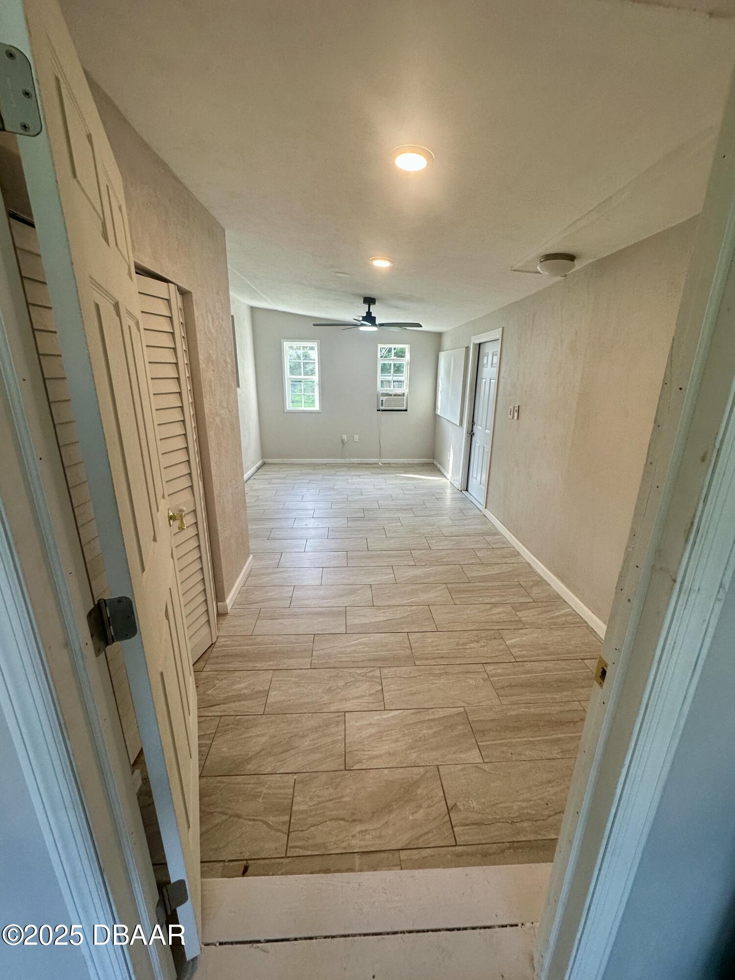 705 Largo Way South Daytona, FL 32119 - Photo 5 of 11 a view of a hallway view with wooden floor and staircase