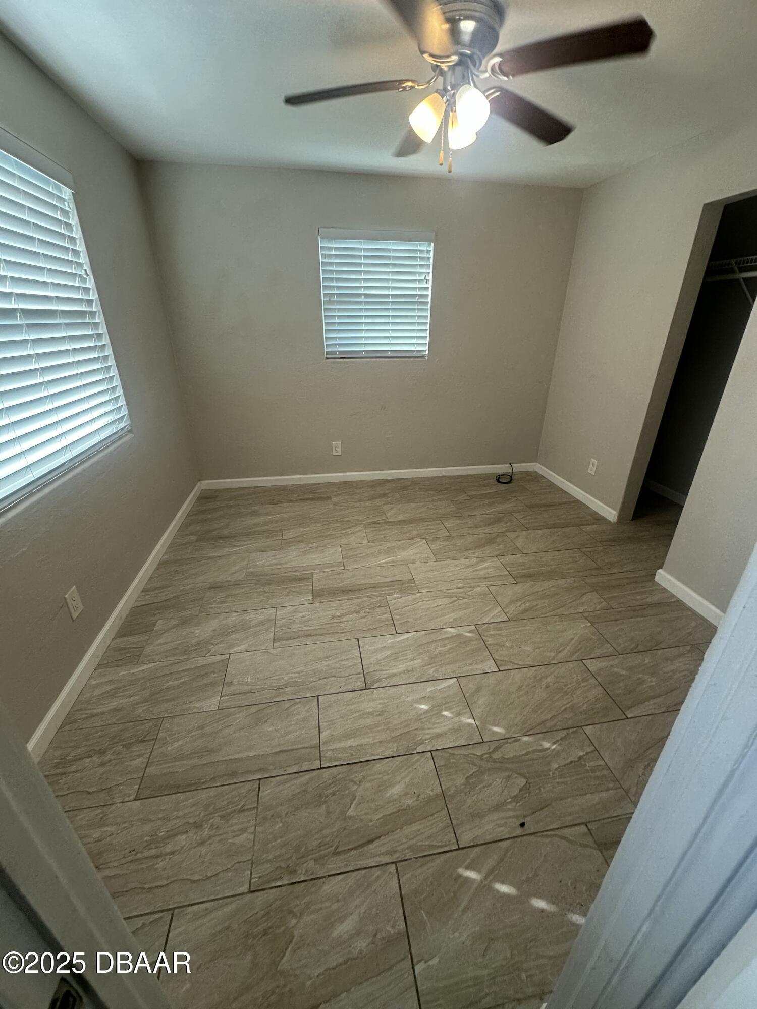 705 Largo Way South Daytona, FL 32119 - Photo 6 of 11 a view of empty room with window