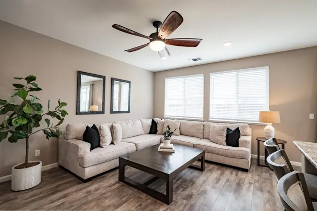 a living room with furniture and a large window