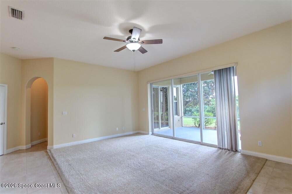 1175 Clubhouse Drive Rockledge, FL 32955 - Photo 13 of 40 a view of an empty room with a window