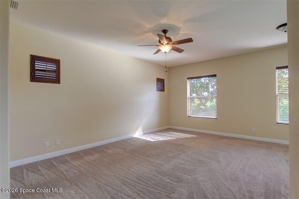 1175 Clubhouse Drive Rockledge, FL 32955 - Photo 19 of 40 a view of an empty room with a window
