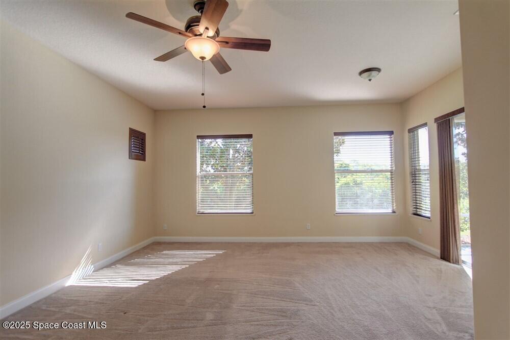 1175 Clubhouse Drive Rockledge, FL 32955 - Photo 21 of 40 a view of an empty room with a window