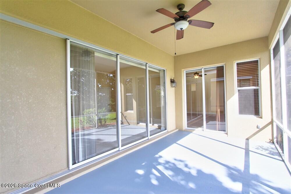 1175 Clubhouse Drive Rockledge, FL 32955 - Photo 29 of 40 a view of a livingroom with a ceiling fan and window