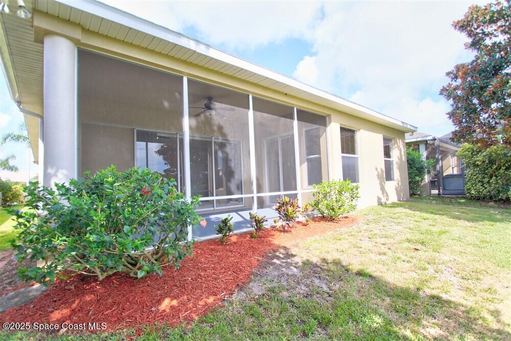 1175 Clubhouse Drive Rockledge, FL 32955 - Photo 30 of 40 front view of a house with a yard