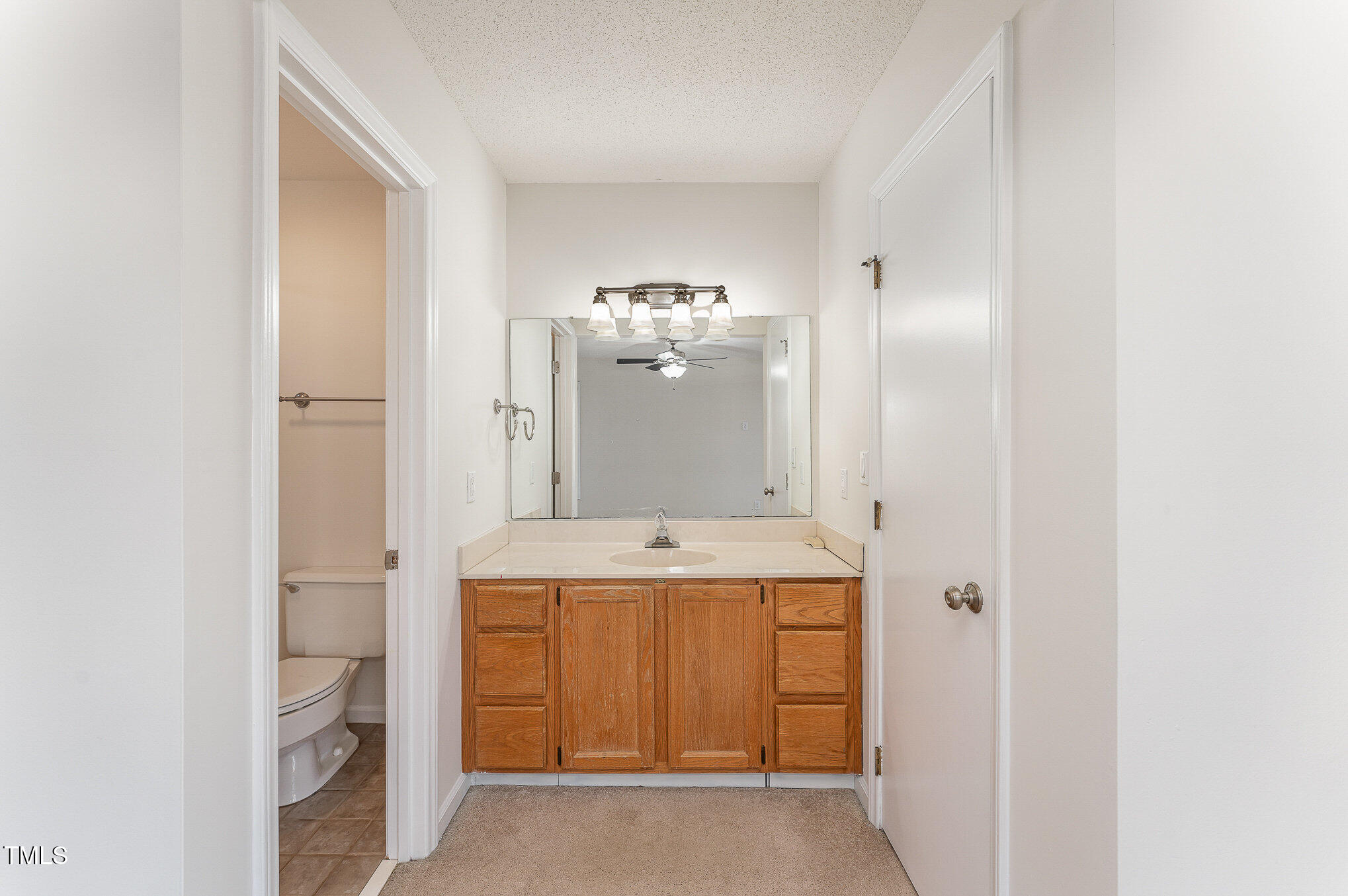 25 Sandstone Ridge Drive Durham, NC 27713 - Photo 13 of 33 a bathroom with a sink and a mirror