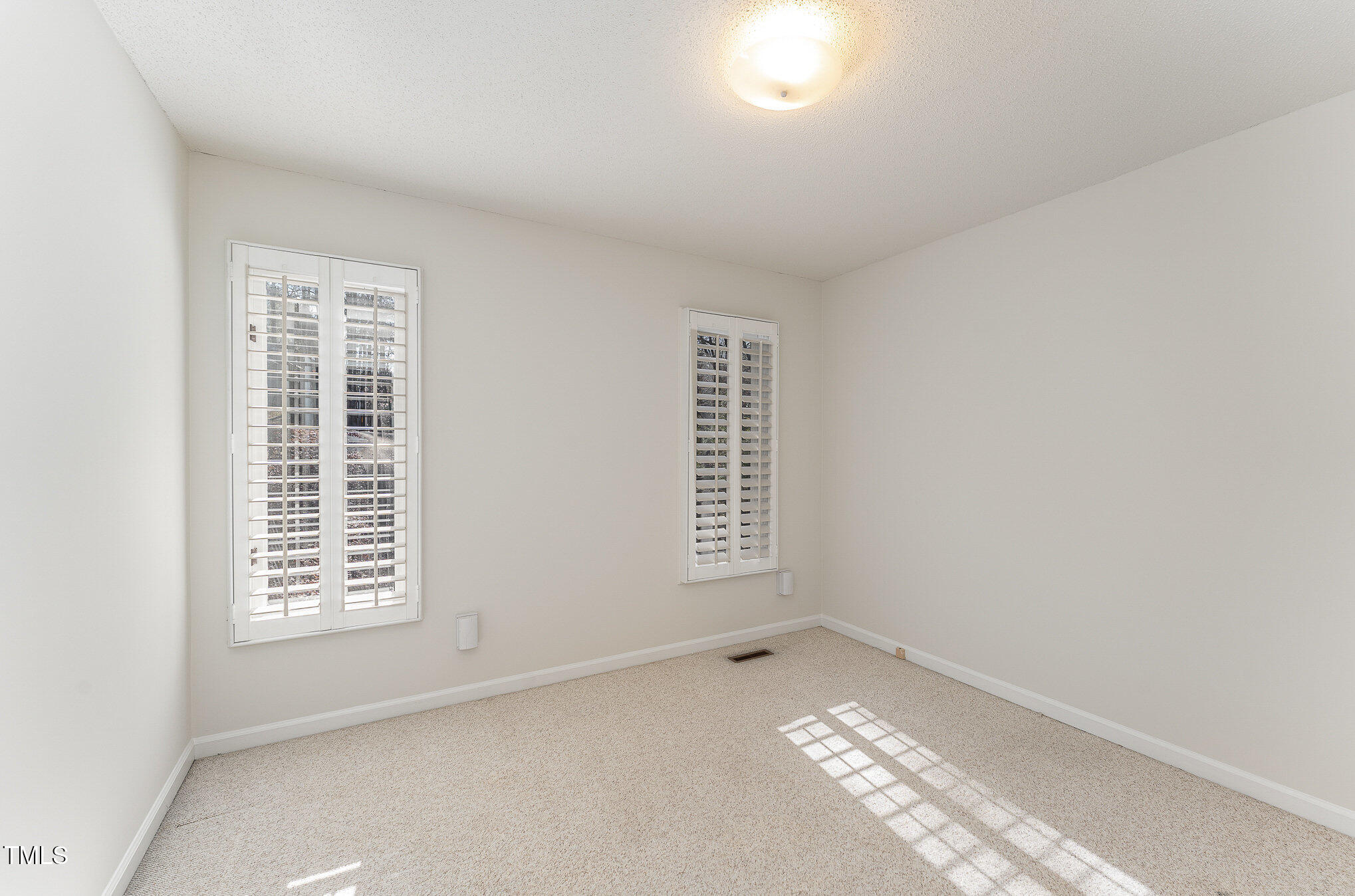 25 Sandstone Ridge Drive Durham, NC 27713 - Photo 16 of 33 a view of an empty room with a window