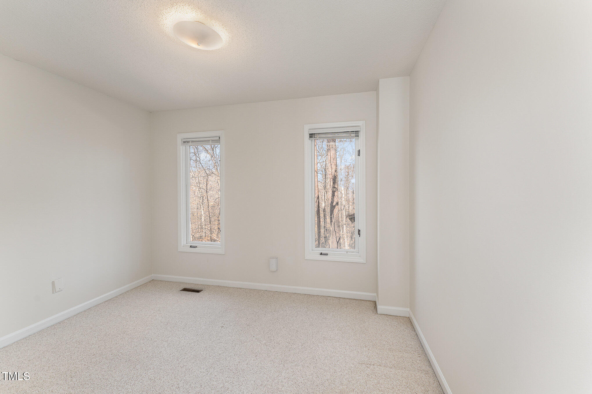 25 Sandstone Ridge Drive Durham, NC 27713 - Photo 17 of 33 an empty room with windows