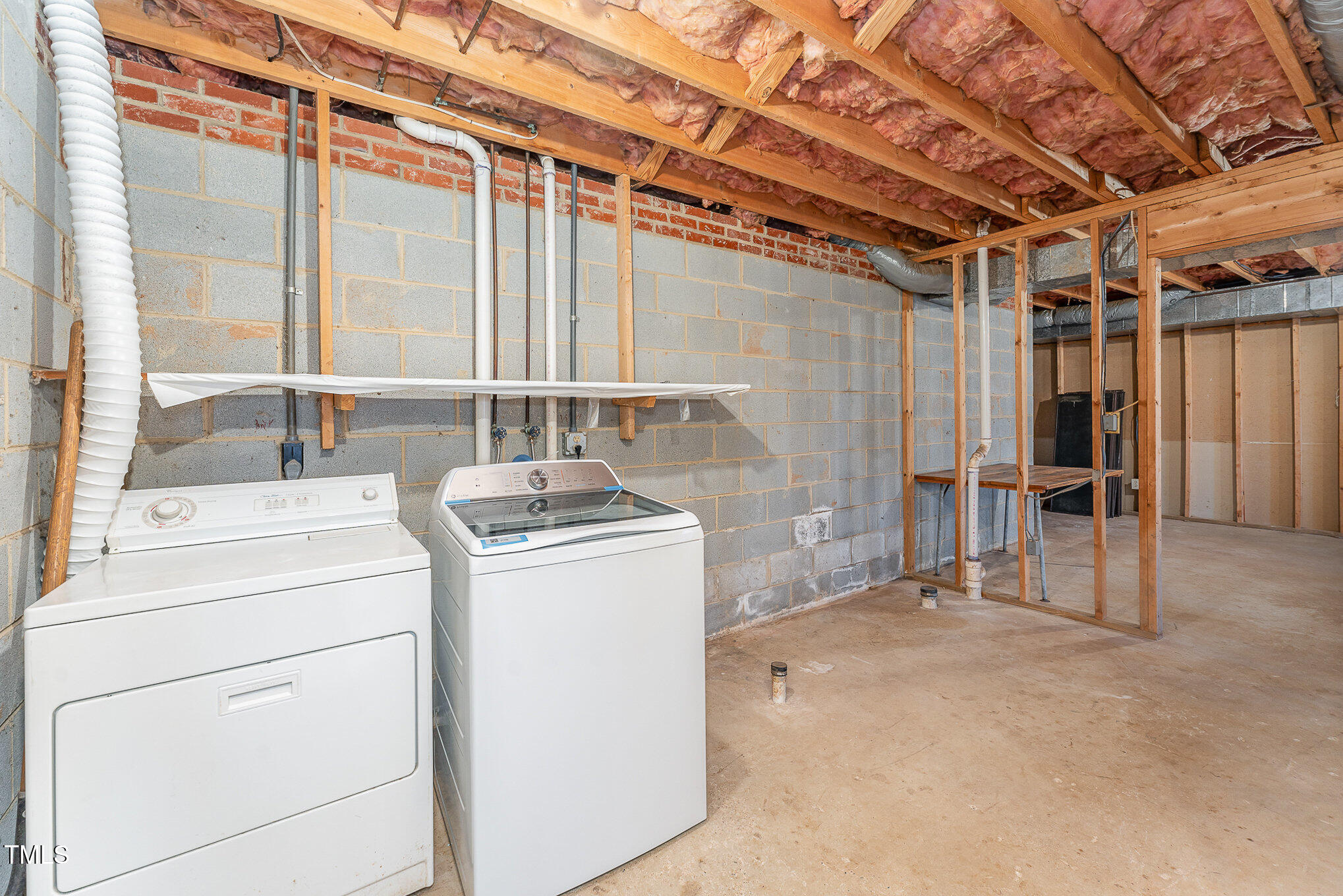 25 Sandstone Ridge Drive Durham, NC 27713 - Photo 21 of 33 a view of storage and utility room with washer and dryer
