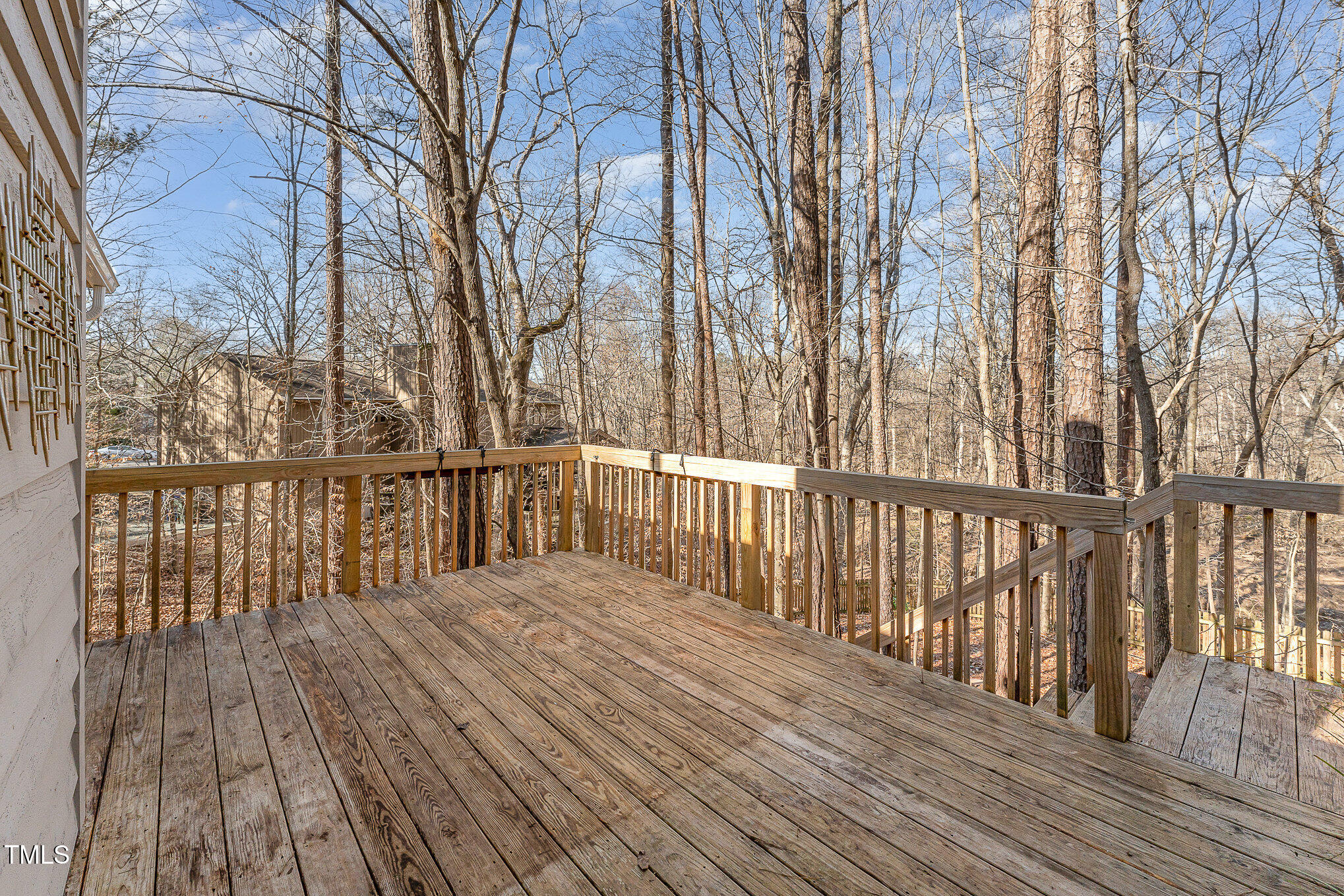 25 Sandstone Ridge Drive Durham, NC 27713 - Photo 23 of 33 a balcony with wooden floor and fence