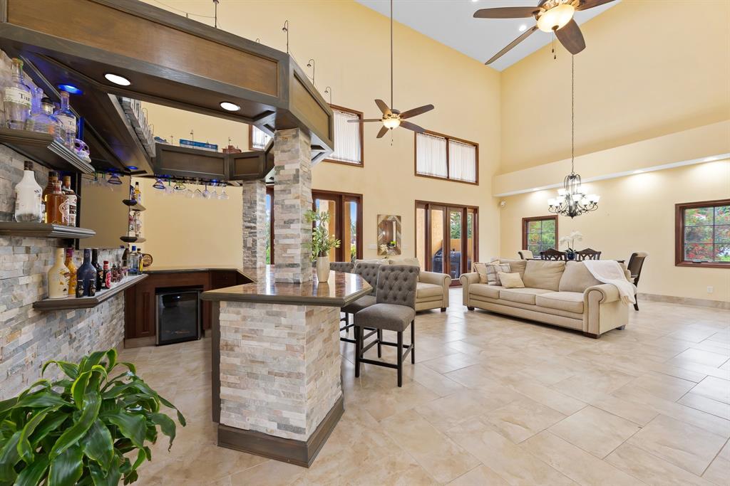 11621 Southwest 1st Street Plantation, FL 33325 - Photo 11 of 47 a living room with furniture and a chandelier