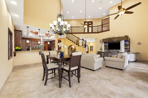 a kitchen with stainless steel appliances granite countertop a stove refrigerator and microwave