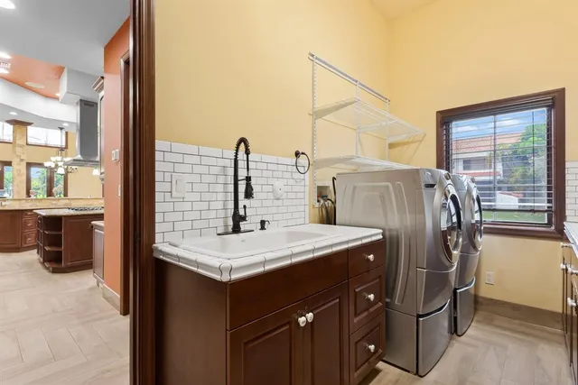 a bathroom with a sink a toilet and mirror